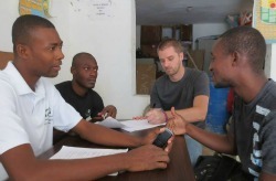 Dustin - third from left - meets with local Haitians
