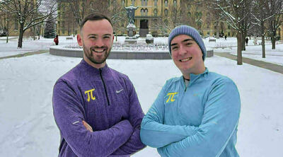 David Carr, an ESTEEM graduate student, left, and Chris Fakhimi, a computer science graduate student, right.